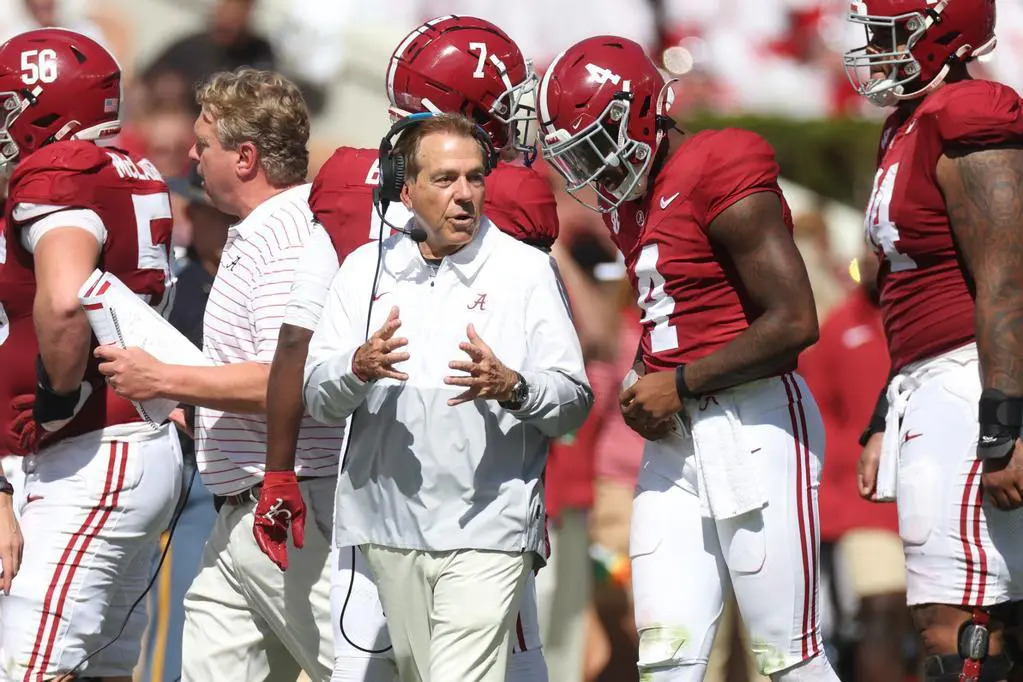 Nick Saban interacting with players at practice